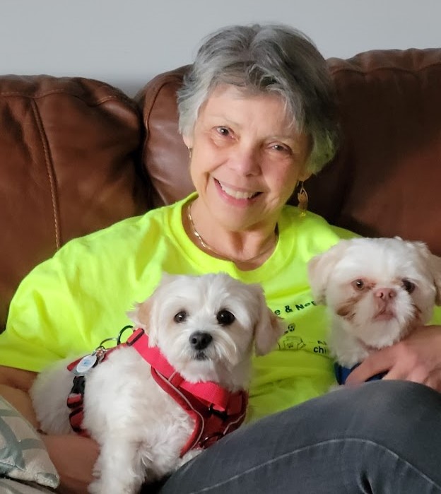 Catina Caban-Owen and her two little white dogs