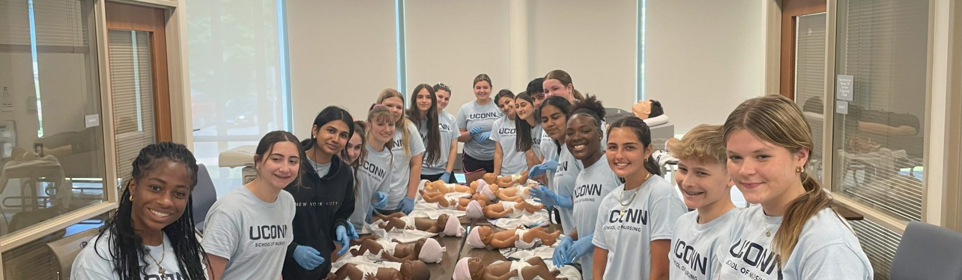 EINP students diapering the Sim Babies